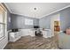 Spacious home office with modern desk, custom cabinetry, and large window for natural light and productivity at 507 Littleport Dr, Rolesville, NC 27571