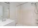 All white bathroom with combined shower and tub at 5073 Tall Pines Ct, Raleigh, NC 27609