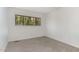 Neutral bedroom with carpet and a bright window view of outside at 5073 Tall Pines Ct, Raleigh, NC 27609