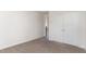 A bedroom featuring neutral carpet and a closet at 5073 Tall Pines Ct, Raleigh, NC 27609