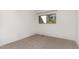 Cozy bedroom with neutral carpet and a single window at 5073 Tall Pines Ct, Raleigh, NC 27609