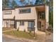 Charming townhouse exterior with a covered entryway, multiple windows, and simple landscaping at 5073 Tall Pines Ct, Raleigh, NC 27609