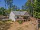 Aerial view of the home, highlighting the spacious backyard and outdoor living areas at 5163 S River Rd, Lillington, NC 27546