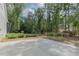 A large cement patio and garden provide ample space for outdoor enjoyment at 5163 S River Rd, Lillington, NC 27546