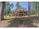 Spacious backyard featuring a patio, fire pit, and plenty of room for outdoor activities at 5163 S River Rd, Lillington, NC 27546