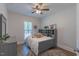 Cozy bedroom with ample natural light, stylish furniture, and comfortable decor at 5163 S River Rd, Lillington, NC 27546