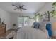 Bright bedroom with hardwood floors, ceiling fan, french doors to the deck, and lots of natural light at 5163 S River Rd, Lillington, NC 27546