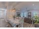 Open-concept dining room with modern lighting, views of the living area, and stylish décor at 5163 S River Rd, Lillington, NC 27546