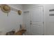Cozy entryway with built-in bench seating, coat hooks, and a neutral color palette at 5163 S River Rd, Lillington, NC 27546