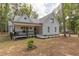 Charming home showcasing a well-manicured lawn, inviting front porch, and lovely curb appeal at 5163 S River Rd, Lillington, NC 27546