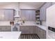 Kitchen with white countertops, gray cabinets, stainless steel appliances, and subway tile backsplash at 5163 S River Rd, Lillington, NC 27546