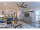 Open-concept living area with kitchen access, a dining area, comfortable seating, and a large ceiling fan at 5163 S River Rd, Lillington, NC 27546