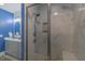 Elegant tiled shower with glass enclosure in updated bathroom at 5163 S River Rd, Lillington, NC 27546