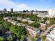 Beautiful aerial view of the townhomes with scenic city views, lush trees, and well-maintained landscaping on a bright day at 531 N Person St # 205, Raleigh, NC 27604