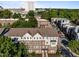 Aerial view of townhome community nestled among lush trees, offering a serene living environment at 531 N Person St # 205, Raleigh, NC 27604