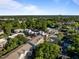 Scenic aerial view showcases the neighborhood's lush tree coverage and well-maintained streets on a bright day at 531 N Person St # 205, Raleigh, NC 27604
