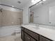 Bathroom features a shower-tub combo with tile surround, toilet, and vanity with a sink at 531 N Person St # 205, Raleigh, NC 27604