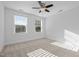 Bright bedroom features neutral carpet, ceiling fan, and white walls, offering a serene and comfortable space at 531 N Person St # 205, Raleigh, NC 27604