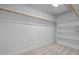 Walk-in closet with rod, shelving, and carpet providing organized storage space at 531 N Person St # 205, Raleigh, NC 27604