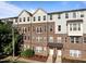 Brick townhome complex with well-kept landscaping, offering a blend of comfort and style at 531 N Person St # 205, Raleigh, NC 27604