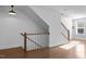 Hallway view featuring hardwood floors, staircase and window at 531 N Person St # 205, Raleigh, NC 27604