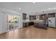 Modern kitchen with stainless appliances, granite counters, central island, and balcony, ideal for cooking at 531 N Person St # 205, Raleigh, NC 27604