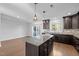 Spacious kitchen featuring granite countertops, stainless steel appliances, a center island, and hardwood floors at 531 N Person St # 205, Raleigh, NC 27604