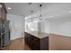 Modern kitchen with granite island, stainless steel appliances, and an open layout to the living space at 531 N Person St # 205, Raleigh, NC 27604