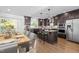 Stylish kitchen features an island, stainless steel appliances, wood floors and a dining area at 531 N Person St # 205, Raleigh, NC 27604