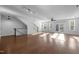 Open-concept living area with hardwood floors, access to a balcony, and modern fixtures for a stylish design at 531 N Person St # 205, Raleigh, NC 27604