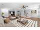 Open-concept living room features hardwood floors, a ceiling fan and bright natural light at 531 N Person St # 205, Raleigh, NC 27604