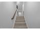 Bright staircase featuring carpeted steps and modern lighting, offering a seamless transition between floors at 531 N Person St # 205, Raleigh, NC 27604