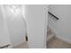 Bright staircase featuring carpeted steps and modern lighting, offering a seamless transition between floors at 531 N Person St # 205, Raleigh, NC 27604