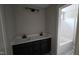 Modern bathroom with dual sinks, stylish lighting, and a separate tub at 55 Stream View Way, Spring Hope, NC 27882