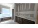 Bathroom featuring dual vanity, quartz countertop, and tub under the window at 55 Stream View Way, Spring Hope, NC 27882