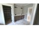 Modern bathroom with a walk-in closet, dual vanity sinks, neutral wall color, and walk-in shower at 55 Stream View Way, Spring Hope, NC 27882