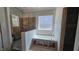 Bathroom featuring built-in tub and a window for natural light at 55 Stream View Way, Spring Hope, NC 27882
