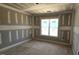 Bedroom with large window providing ample natural light at 55 Stream View Way, Spring Hope, NC 27882