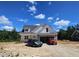 Charming new construction home with stone accents, white siding, and a two-car garage at 55 Stream View Way, Spring Hope, NC 27882