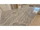 Close-up shot highlighting the gray, swirling pattern in the beautiful granite kitchen island counter at 55 Stream View Way, Spring Hope, NC 27882