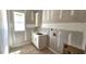 Laundry room with sink and cabinet, designed for convenience at 55 Stream View Way, Spring Hope, NC 27882