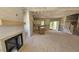 Open concept living room and kitchen area with fireplace and large island at 55 Stream View Way, Spring Hope, NC 27882
