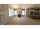 Bright living room with large windows and fireplace feature at 55 Stream View Way, Spring Hope, NC 27882