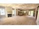 Open concept living room and kitchen area with fireplace and large island at 55 Stream View Way, Spring Hope, NC 27882