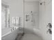 Bathroom featuring a spacious glass shower with bench and herringbone tile work at 623 Westfall Way, Chapel Hill, NC 27517