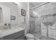 Modern bathroom featuring marble shower, updated vanity and fixtures at 623 Westfall Way, Chapel Hill, NC 27517
