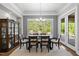 Elegant dining room with natural light and glass doors leading to outdoor space at 623 Westfall Way, Chapel Hill, NC 27517