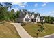 Beautifully landscaped home with an extended driveway leading to the house, perfect for curb appeal at 623 Westfall Way, Chapel Hill, NC 27517