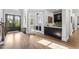 Inviting foyer with hardwood floors leads to a study and features a convenient wet bar area at 623 Westfall Way, Chapel Hill, NC 27517