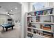 Spacious game room with pool table, wainscoting, and a view into a reading nook with bookshelves at 623 Westfall Way, Chapel Hill, NC 27517